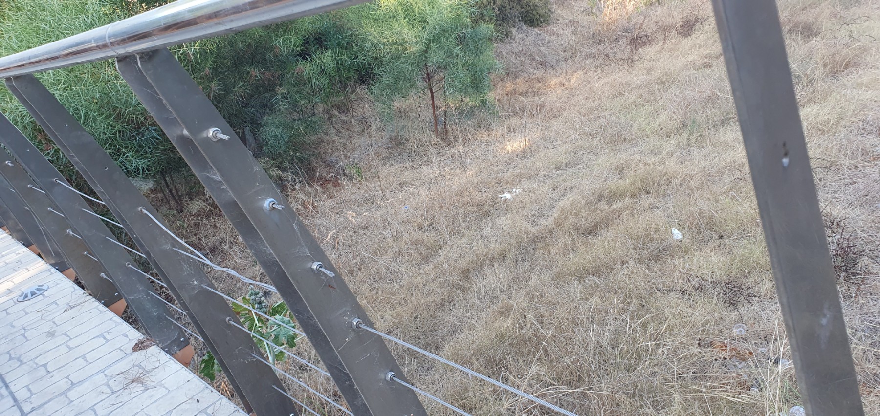 *Dangerous* - Damaged and missing safety cables on footbridge